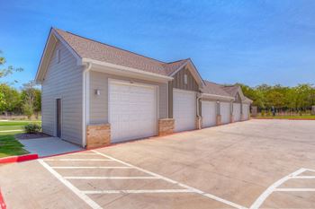 a row of garages with a blue sky in the background